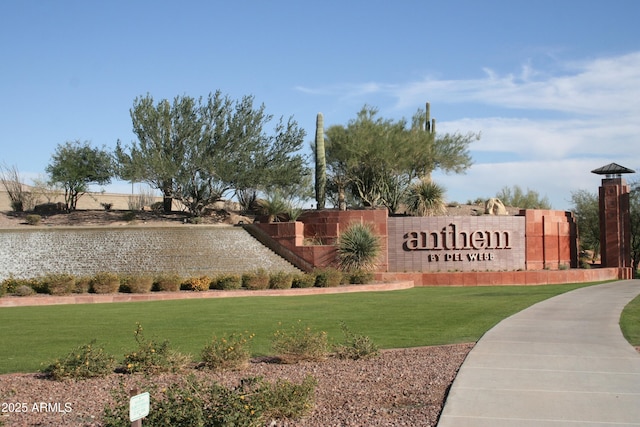 community sign featuring a lawn