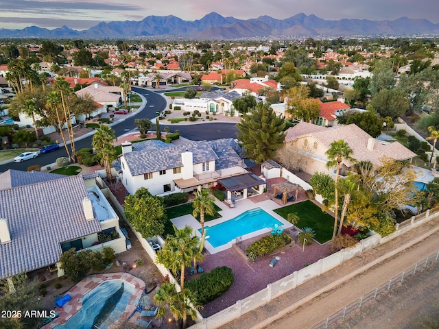 drone / aerial view with a residential view and a mountain view