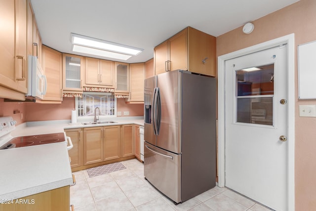 kitchen with light brown cabinetry, sink, light tile patterned floors, electric range, and stainless steel fridge with ice dispenser