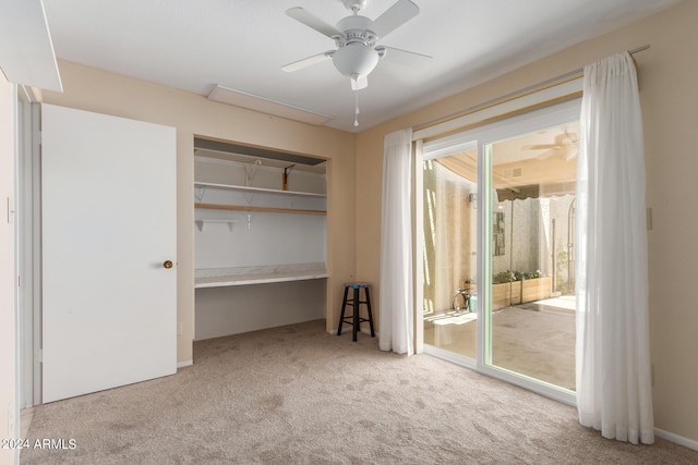 unfurnished bedroom featuring access to outside, light colored carpet, and ceiling fan