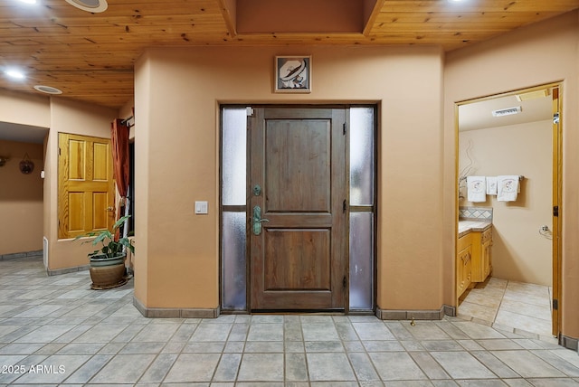 entrance foyer with wood ceiling