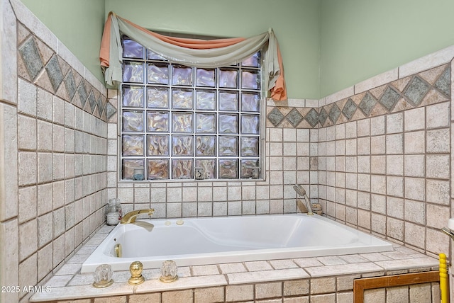 bathroom featuring tiled bath and tile walls