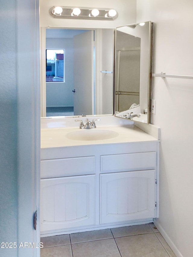 bathroom featuring vanity and tile patterned flooring