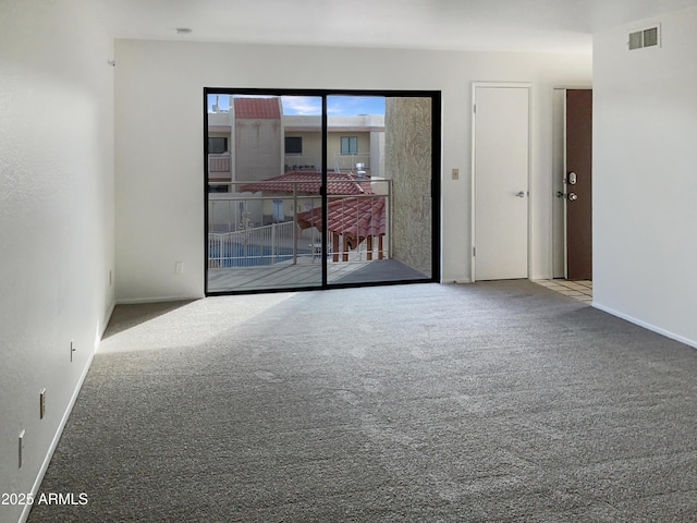 unfurnished room with carpet flooring