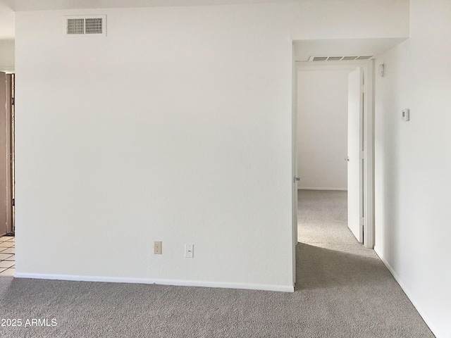 unfurnished room with light colored carpet