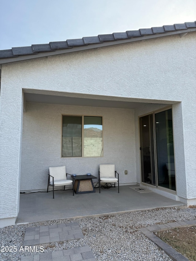 rear view of house featuring a patio