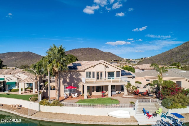 5281 W Quail Ave, Glendale, AZ 85308 - back of property with a fenced backyard, a patio, solar panels, and a mountain view