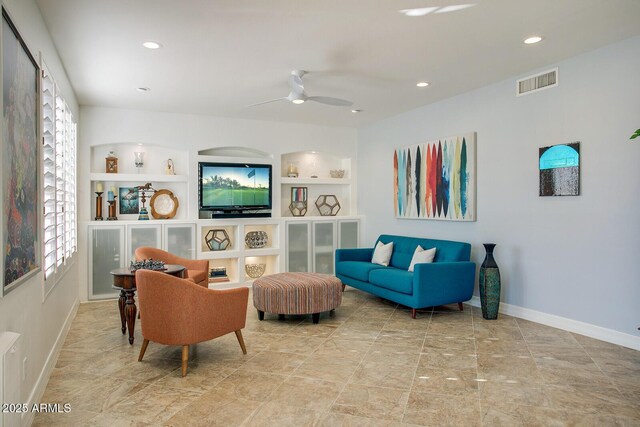 5281 W Quail Ave, Glendale, AZ 85308 - living room featuring ceiling fan, built in features, baseboards, recessed lighting, and stone finish flooring
