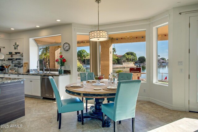 5281 W Quail Ave, Glendale, AZ 85308 - dining area with recessed lighting, light tile patterned floors, and a water view