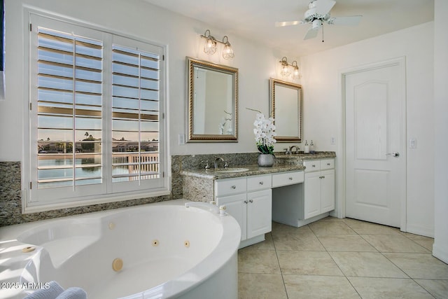 5281 W Quail Ave, Glendale, AZ 85308 - bathroom with tile patterned flooring, a jetted tub, double vanity, and a ceiling fan