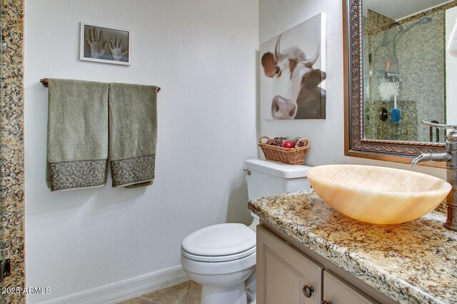 5281 W Quail Ave, Glendale, AZ 85308 - full bathroom with toilet, a shower, vanity, and baseboards