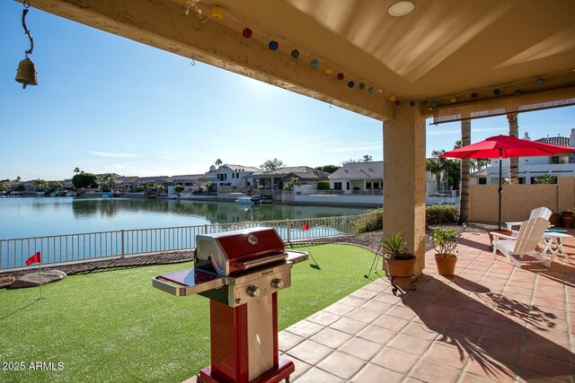 5281 W Quail Ave, Glendale, AZ 85308 - view of patio / terrace featuring a residential view, a water view, a fenced backyard, and grilling area