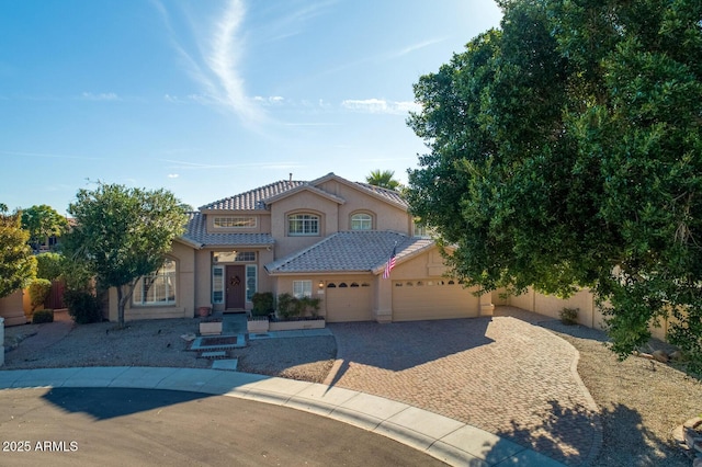 5281 W Quail Ave, Glendale, AZ 85308 - mediterranean / spanish home with an attached garage, stucco siding, driveway, a tile roof, and fence
