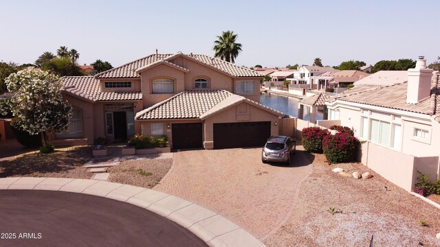 5281 W Quail Ave, Glendale, AZ 85308 - mediterranean / spanish home featuring an attached garage, driveway, stucco siding, a tile roof, and fence