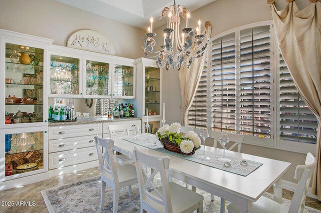 5281 W Quail Ave, Glendale, AZ 85308 - dining space featuring wet bar and a chandelier