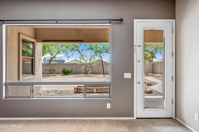 19245 W Pasadena Ave, Litchfield Park, AZ 85340 - doorway to outside featuring carpet and baseboards