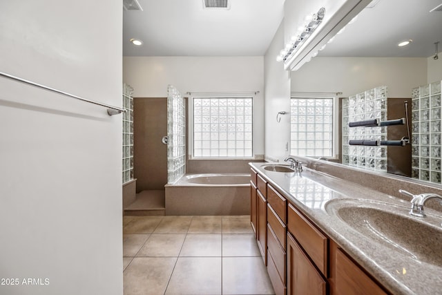 19245 W Pasadena Ave, Litchfield Park, AZ 85340 - full bath featuring tile patterned floors, a walk in shower, a bath, and double vanity
