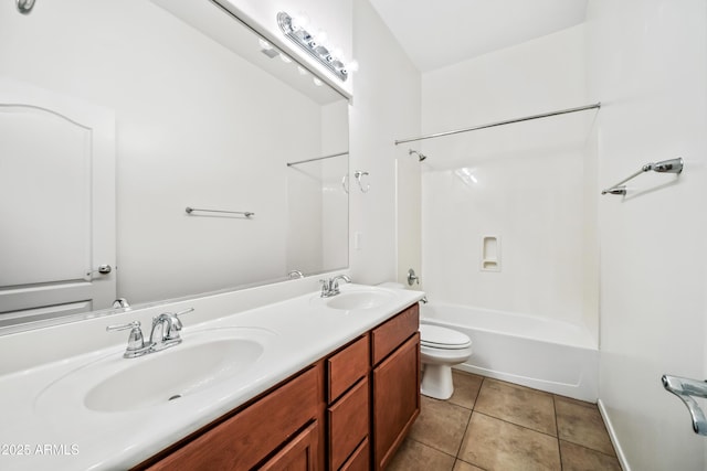 19245 W Pasadena Ave, Litchfield Park, AZ 85340 - full bath featuring tile patterned flooring, toilet, double vanity, and shower / washtub combination