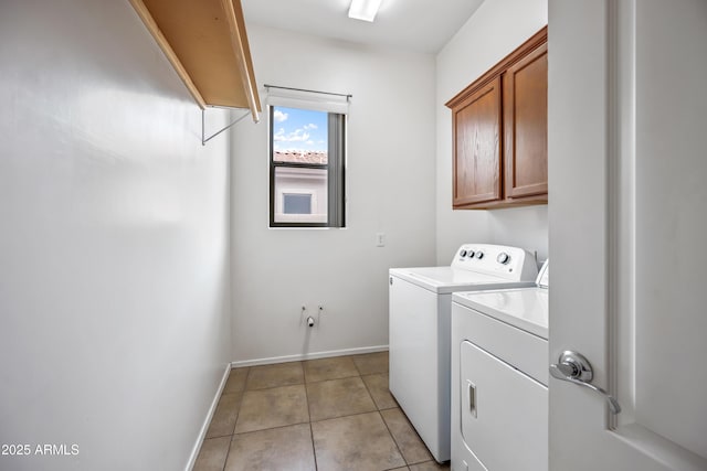 19245 W Pasadena Ave, Litchfield Park, AZ 85340 - laundry room with washer and dryer, cabinet space, baseboards, and light tile patterned floors