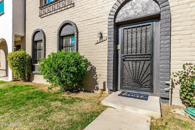 property entrance with a yard