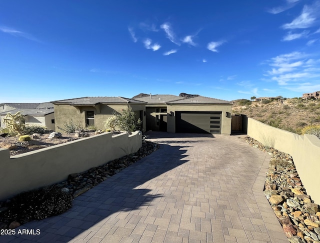 prairie-style house featuring a garage