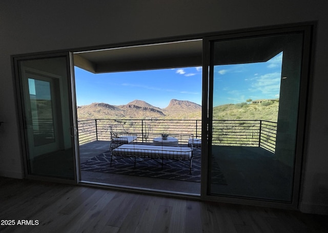 entryway with a mountain view and hardwood / wood-style flooring