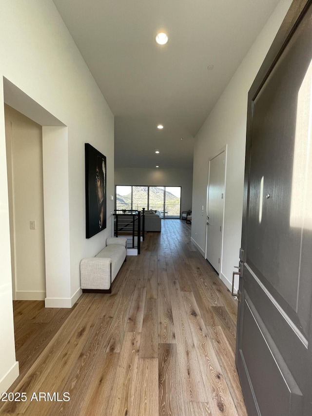 hall with light hardwood / wood-style flooring