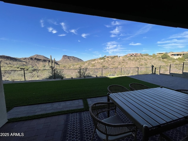 view of yard featuring a mountain view and a patio area