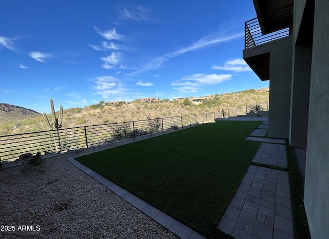 view of yard featuring a balcony