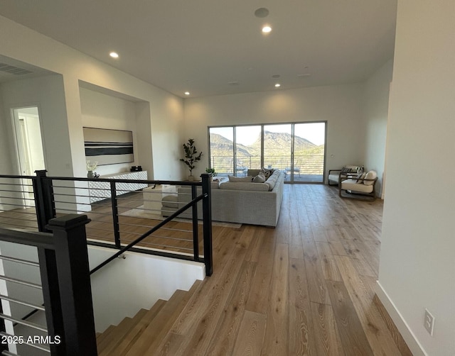 interior space with a mountain view and wood-type flooring