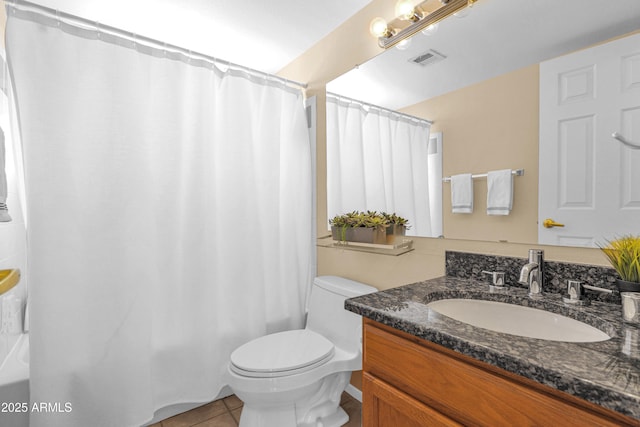 bathroom with tile patterned floors, toilet, and vanity