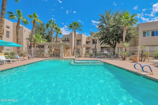 view of swimming pool with a patio area and a pergola