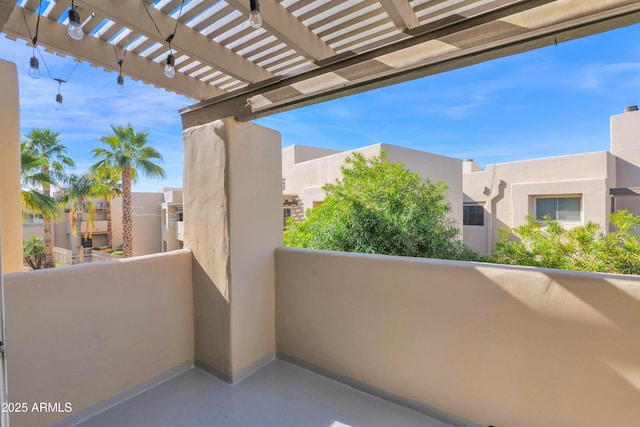 balcony featuring a pergola