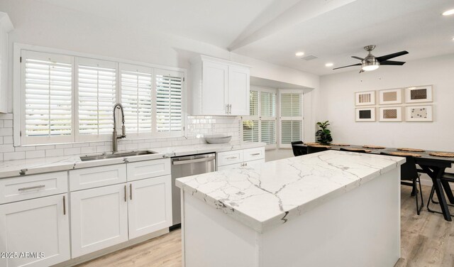 13620 N 80th Pl, Scottsdale, AZ 85260 - kitchen with stainless steel dishwasher, a sink, backsplash, light wood-type flooring, and recessed lighting