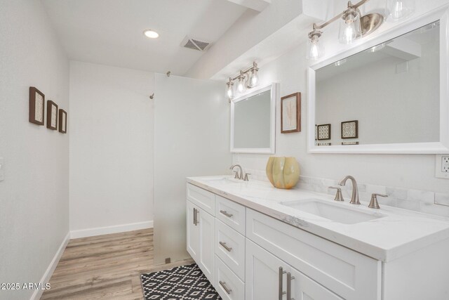 13620 N 80th Pl, Scottsdale, AZ 85260 - full bathroom with double vanity, recessed lighting, wood finished floors, and baseboards