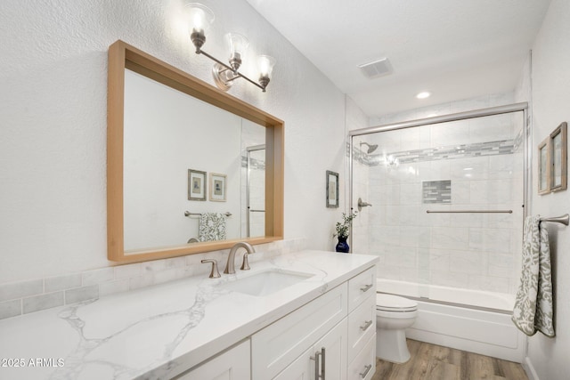 13620 N 80th Pl, Scottsdale, AZ 85260 - bathroom with vanity, wood finished floors, toilet, and enclosed tub / shower combo