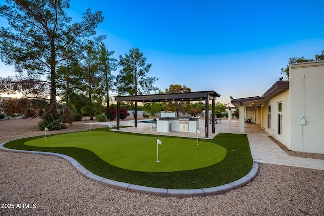 13620 N 80th Pl, Scottsdale, AZ 85260 - view of property's community featuring a putting area, a patio area, and an outdoor kitchen