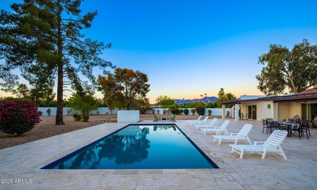 13620 N 80th Pl, Scottsdale, AZ 85260 - pool at dusk featuring a patio and an outdoor pool