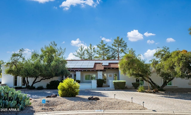 13620 N 80th Pl, Scottsdale, AZ 85260 - view of front of property with a tiled roof, roof mounted solar panels, and stucco siding