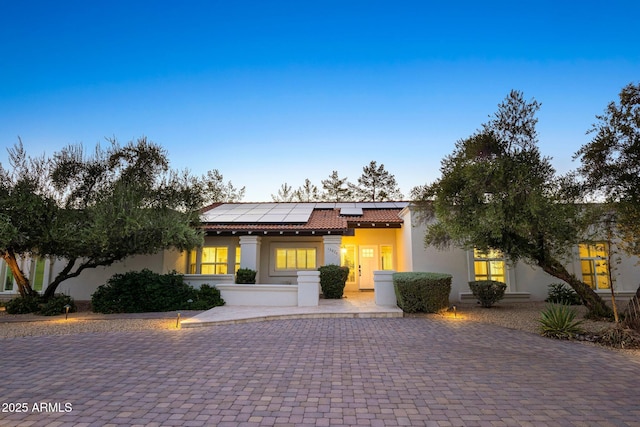 13620 N 80th Pl, Scottsdale, AZ 85260 - mediterranean / spanish home with a tiled roof, roof mounted solar panels, and stucco siding