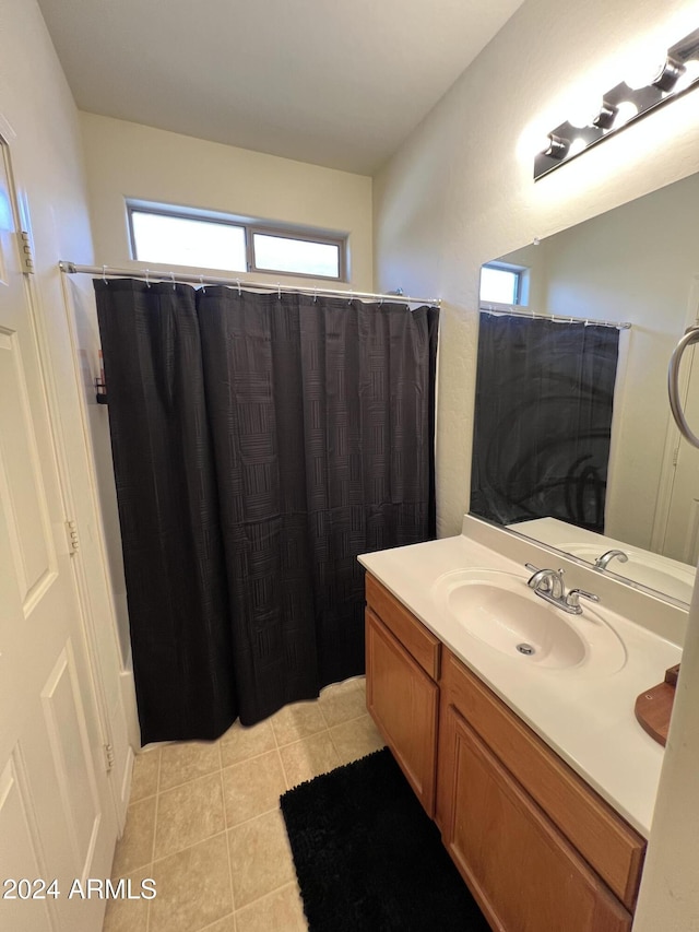 bathroom with tile patterned flooring, vanity, and a shower with shower curtain