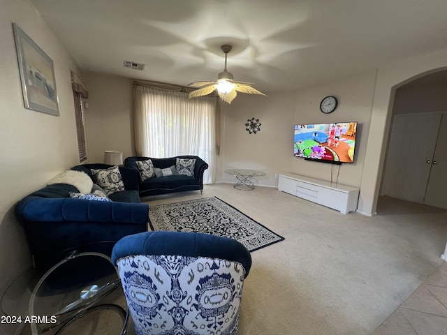 living room featuring ceiling fan and light colored carpet