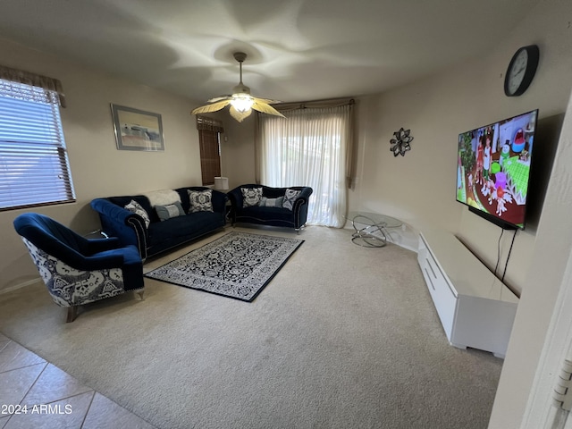 carpeted living room featuring ceiling fan