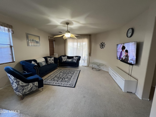 carpeted living room featuring ceiling fan