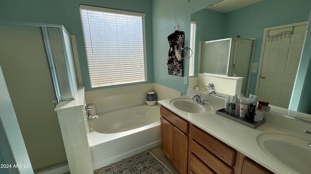 bathroom featuring separate shower and tub and vanity