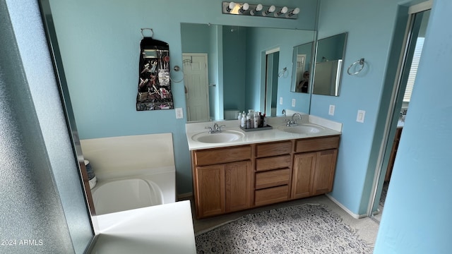 bathroom featuring vanity and a tub to relax in