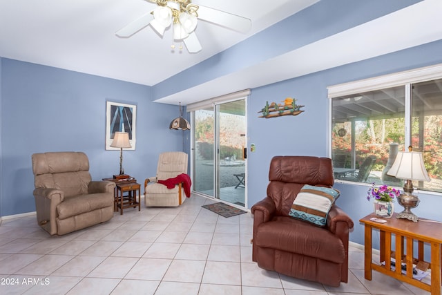 sitting room featuring ceiling fan and light tile patterned floors