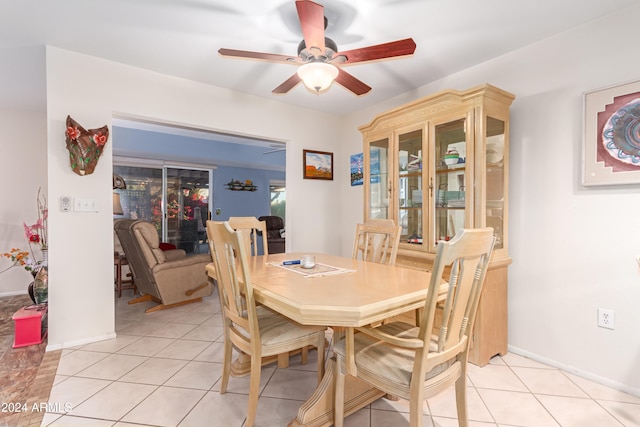 dining area with ceiling fan and light tile patterned floors