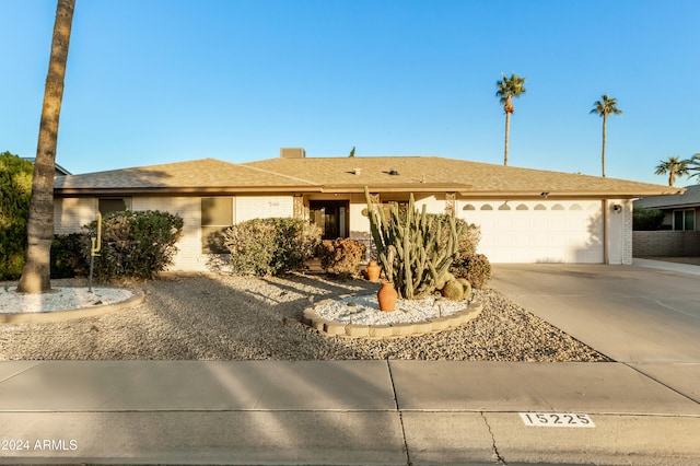 ranch-style home featuring a garage