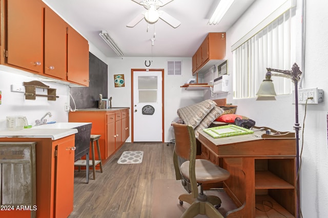 kitchen featuring ceiling fan and dark wood-type flooring